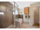 Modern bathroom with a glass-enclosed shower, soaking tub, and updated fixtures at 42 Blue Sage, Littleton, CO 80127
