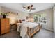 Relaxing bedroom with ample natural light, soft decor, and comfortable furnishings at 42 Blue Sage, Littleton, CO 80127