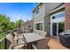 Relax on the deck with outdoor table and chairs, great for outdoor entertaining at 42 Blue Sage, Littleton, CO 80127