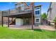 Exterior view of a two-story home with a deck, covered patio, and well-maintained yard at 42 Blue Sage, Littleton, CO 80127