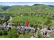 Aerial view of a cozy home in a well-kept residential area, backing onto a picturesque landscape at 42 Blue Sage, Littleton, CO 80127