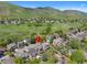 Scenic neighborhood view highlighting the property's location near green spaces and rolling hills at 42 Blue Sage, Littleton, CO 80127