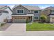 Charming two-story home with a well-manicured lawn, brick accents and an attached two car garage at 42 Blue Sage, Littleton, CO 80127
