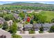 Beautiful suburban home with a well-maintained lawn and mature trees in a peaceful neighborhood at 42 Blue Sage, Littleton, CO 80127