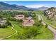 Expansive horse property with well-maintained facilities, set against a stunning mountain backdrop at 42 Blue Sage, Littleton, CO 80127