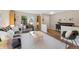 Bright living room with modern furniture and a large window offering a pleasant view at 42 Blue Sage, Littleton, CO 80127