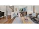 Open-concept living area showcasing stylish decor and seamless flow to the dining room at 42 Blue Sage, Littleton, CO 80127