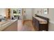 Open-concept living room with stylish furniture and seamless flow to the entryway at 42 Blue Sage, Littleton, CO 80127