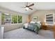 Serene main bedroom with vaulted ceilings, large windows, and a peaceful ambiance at 42 Blue Sage, Littleton, CO 80127