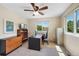 Bright office features large windows, ceiling fan, and versatile space for work or study at 42 Blue Sage, Littleton, CO 80127