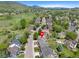 Charming home on a tree-lined street with mountain views, showcasing the neighborhood's tranquil setting at 42 Blue Sage, Littleton, CO 80127
