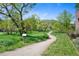 Walking path near lush greenery and trees at 42 Blue Sage, Littleton, CO 80127