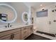 Contemporary bathroom with double vanity, glass shower, and accent tile at 375 Marshall Rd, Superior, CO 80027