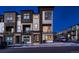 Contemporary townhome showcases a stylish exterior, private balconies, well-kept landscaping, and street parking at 375 Marshall Rd, Superior, CO 80027