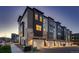 Modern townhome exterior featuring varied siding materials and individual garages, creating an attractive street view at 375 Marshall Rd, Superior, CO 80027