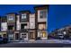 Modern townhome with a multi-tone exterior, private balconies, well-manicured landscaping, and dedicated parking at 375 Marshall Rd, Superior, CO 80027