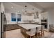 Modern kitchen with a center island featuring a breakfast bar, granite countertops, and stainless steel appliances at 375 Marshall Rd, Superior, CO 80027