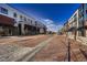 A well-maintained brick paved street lined with buildings, offering a pedestrian-friendly shopping and residential experience at 375 Marshall Rd, Superior, CO 80027