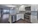 Modern kitchen with stainless steel appliances, granite countertops, and open floor plan at 8765 W Cornell Ave # 3, Lakewood, CO 80227