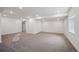 A large basement with neutral carpeting and recessed lighting at 1376 Lumber Ridge N Cir, Erie, CO 80516