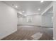 Large basement with neutral carpeting and recessed lighting throughout the space at 1376 Lumber Ridge N Cir, Erie, CO 80516
