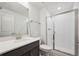 Contemporary bathroom featuring a glass-enclosed shower and a single vanity at 1376 Lumber Ridge N Cir, Erie, CO 80516