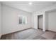 A bright bedroom featuring neutral carpeting and a large closet at 1376 Lumber Ridge N Cir, Erie, CO 80516