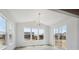 Bright dining room with large windows, stylish chandelier, and plenty of natural light at 1376 Lumber Ridge N Cir, Erie, CO 80516