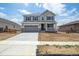 Charming two-story home with a covered porch, two car garage, and neutral color scheme at 1376 Lumber Ridge N Cir, Erie, CO 80516