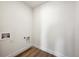 A bright laundry room featuring hook-ups for a washing machine and dryer at 1376 Lumber Ridge N Cir, Erie, CO 80516