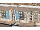 Aerial view of apartment buildings with balconies and a central walkway at 420 E Fremont Pl # 203, Centennial, CO 80122