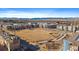 Wide aerial view of a community with a central common area and mountain views in the distance at 420 E Fremont Pl # 203, Centennial, CO 80122
