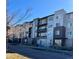 Modern apartment complex with balconies on a street, showcasing its contemporary facade and accessibility at 420 E Fremont Pl # 203, Centennial, CO 80122