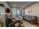 Cozy living room with neutral tones, comfortable seating, and access to a private balcony at 420 E Fremont Pl # 203, Centennial, CO 80122