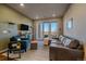 Inviting living room with comfortable seating, natural light, and a balcony view at 420 E Fremont Pl # 203, Centennial, CO 80122