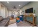 Comfortable living room adjacent to a modern kitchen featuring a ceiling fan and stylish decor at 420 E Fremont Pl # 203, Centennial, CO 80122