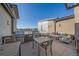 Spacious rooftop deck with built-in barbeque, outdoor dining furniture and inviting fire pit lounge at 420 E Fremont Pl # 203, Centennial, CO 80122