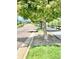Landscaped street view featuring trees, a sidewalk, and well-maintained grassy areas at 420 E Fremont Pl # 203, Centennial, CO 80122