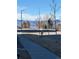 Scenic street view with mature trees and mountain views at 420 E Fremont Pl # 203, Centennial, CO 80122