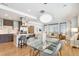 Open concept dining area with glass table and modern chairs at 3026 Zuni St, Denver, CO 80211