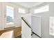 Modern staircase with metal railing leading to upper level at 3026 Zuni St, Denver, CO 80211