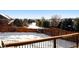 Spacious backyard with a deck and snow covered ground at 600 Balsa Dr, Castle Rock, CO 80104