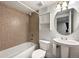 Basement bathroom with tub and pedestal sink at 600 Balsa Dr, Castle Rock, CO 80104