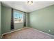 Spacious bedroom with a window and light green walls at 600 Balsa Dr, Castle Rock, CO 80104