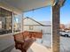 Wooden swing hanging on a covered porch with brick columns at 600 Balsa Dr, Castle Rock, CO 80104