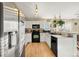 Modern kitchen with stainless steel appliances and light wood floors at 600 Balsa Dr, Castle Rock, CO 80104