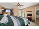 Main bedroom with ceiling fan and access to bathroom at 600 Balsa Dr, Castle Rock, CO 80104