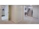 Finished basement with carpeted floors, a storage closet, and direct access to the stairwell at 3434 S Race St, Englewood, CO 80113