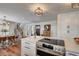 Modern kitchen with stainless steel appliances, quartz countertops, and a breakfast bar with seating at 3434 S Race St, Englewood, CO 80113
