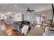 Open-concept living room featuring a gray sectional, modern decor, and access to an outdoor space at 3434 S Race St, Englewood, CO 80113